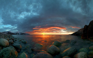 Sunset water rocks mountain beach - wide len free wallpaper