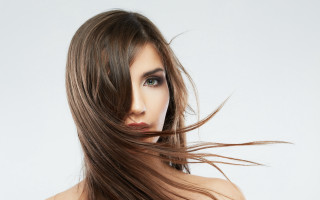 Woman blowing hair blue eyes 3 - flowing free wallpaper