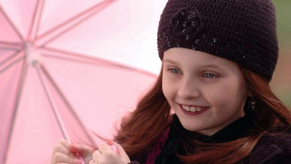 Young girl pink umbrella smiling - a pink umbrella free wallpaper