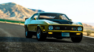 Yellow black car mountain road - dennis flanders free wallpaper