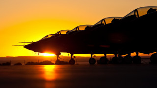 Jet fighter sunset backlit burning - a jet fighter plane free wallpaper