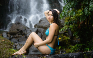 Woman bikini rock waterfall backpack - a waterfall behind her free wallpaper