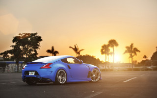 Blue sports car sunset palm - the background and a sun setting free wallpaper
