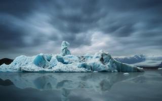 Iceberg lake mountains cloudy sky - a large iceberg free wallpaper