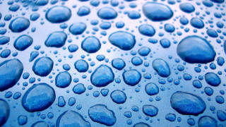 Water droplets blue surface macro 8 - a blue surface free wallpaper