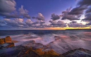 Rocky beach sunset clouds cityscape - a rocky beach free wallpaper for desktop