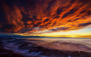 Sunset mountain range clouds snow - the ground below free wallpaper
