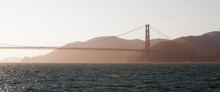 Bridge mountains lake boat sunset - a large bridge free wallpaper