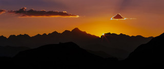 Sunset bird mountain crepuscular rays - over a mountain range free wallpaper