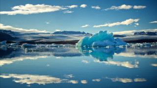 Iceberg lake mountains clouds blue - a large iceberg free wallpaper
