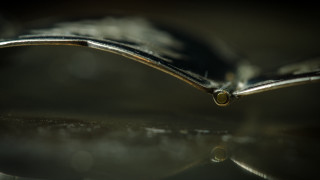 Metal reflection kinetic art macro - a close up of a metal object free wallpaper