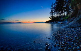 Beach rocks trees sunset blue - a blue sky and water free wallpaper