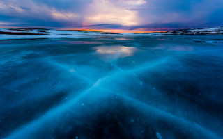 Frozen lake sunset clouds ice - a sun setting free wallpaper