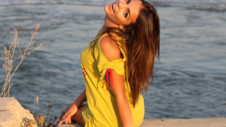 Woman yellow dress water ponytail - long dark hair free wallpaper