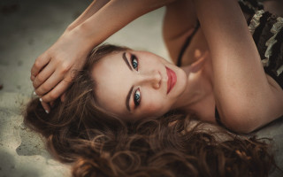 Woman laying hair air eyes - a portrait free wallpaper for desktop