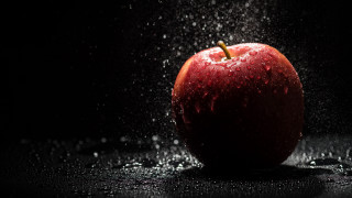 Water splash apple black background - an apple free wallpaper