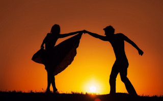 Hilltop couple surfboards sunset backlighting - a couple of people free wallpaper