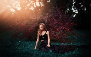Woman sitting grass blackdress sunbeam - artur tarnowski free wallpaper