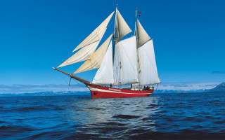 Sailboat ocean mountains blue sky - mountain free wallpaper