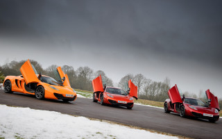 Orange sports cars snowy road - andrew allan free wallpaper