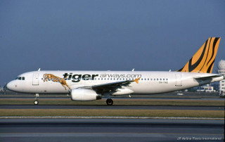 Tiger airways plane runway airport - a sky background and a building in the background free wallpaper