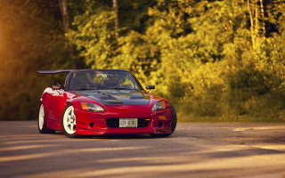 Red sports car autumn leaves 6 - a sunbeam free wallpaper