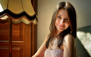 Woman white dress smiling couch - natural free wallpaper