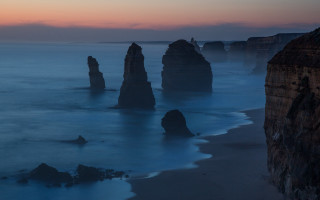 Rocky ocean sunset mountains clouds - a few wave free wallpaper