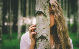 Woman holding tree face forest - a face free wallpaper for desktop