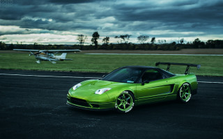 Green sports car runway plane - a green sports car free wallpaper