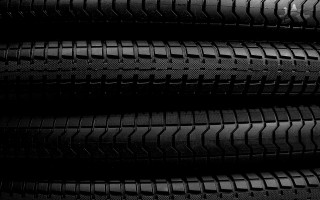 Tire closeup black background white - ai weiwei free wallpaper