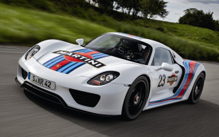 White sports car green hillside - motion blur free wallpaper