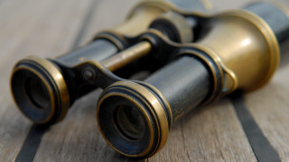 Binoculars wooden table black gold - a wooden surface free wallpaper