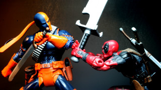 Action figures swords comic scene - their hand and a sword free wallpaper