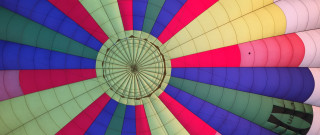 Colorful hot air balloon person - a person inside free wallpaper