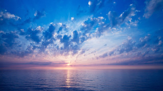 Sunset ocean clouds horizon beach - the sun shining free wallpaper