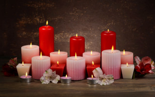 Candles flower vase stilllife romantic - a wall behind them free wallpaper