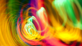 Colorful light swirls kinetic art - a blurry photo free wallpaper