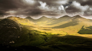 Mountain range cloudy sky green 2 - dramatic light free wallpaper for desktop