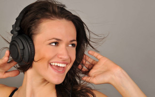 Woman headphones smiling blowing wind - headphone free wallpaper for desktop