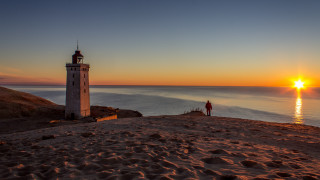 Lighthouse beach sunset person tilt - a lighthouse free wallpaper