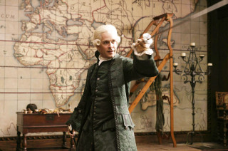 Man green coat pointing map - a map free wallpaper