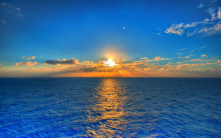 Sunset ocean boat clouds city 2 - free winter wallpaper