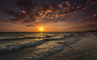 Sunset ocean waves surfboard dusk 2 - a sunset over the ocean free wallpaper for desktop