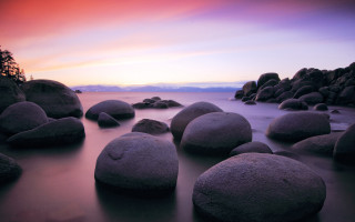 Beach rocks ocean sunset cloudy - a group of rocks free wallpaper