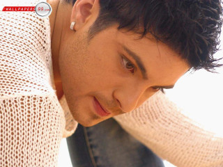 Man leaning head hand looking - his cell phone free wallpaper