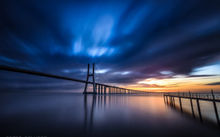 Bridge water sky clouds sunset 4 - a long bridge free wallpaper