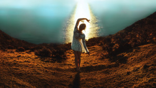 Desert woman outstretched arms light - a desert area free wallpaper