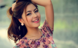 Woman flowered top smiling ponytail 2 - pretty free wallpaper