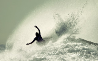 Surfing wave ocean sky silhouette - a person riding free wallpaper